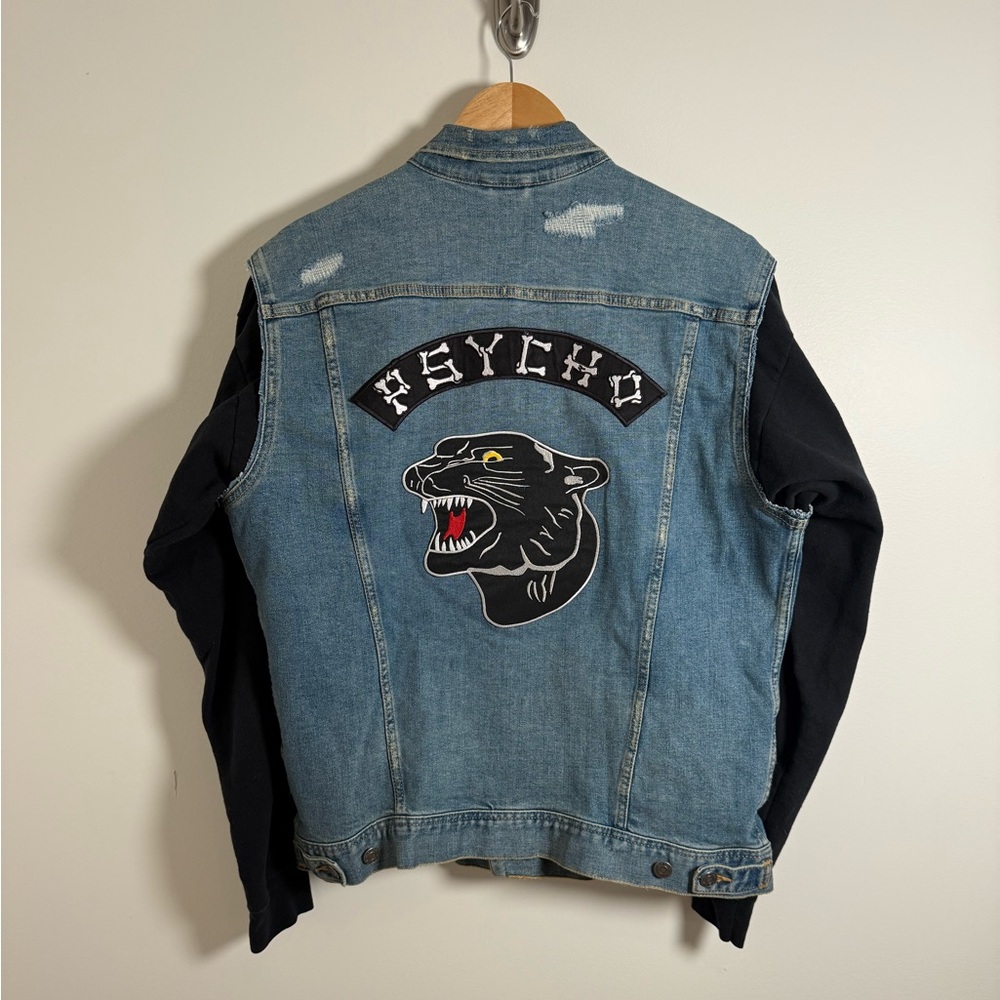Custom Denim Jacket with Tattoo Patches and Black Sweatshirt Sleeves
